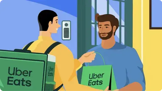 Repartidor entrega un pedido en un domicilio - Imagen de Uber Eats